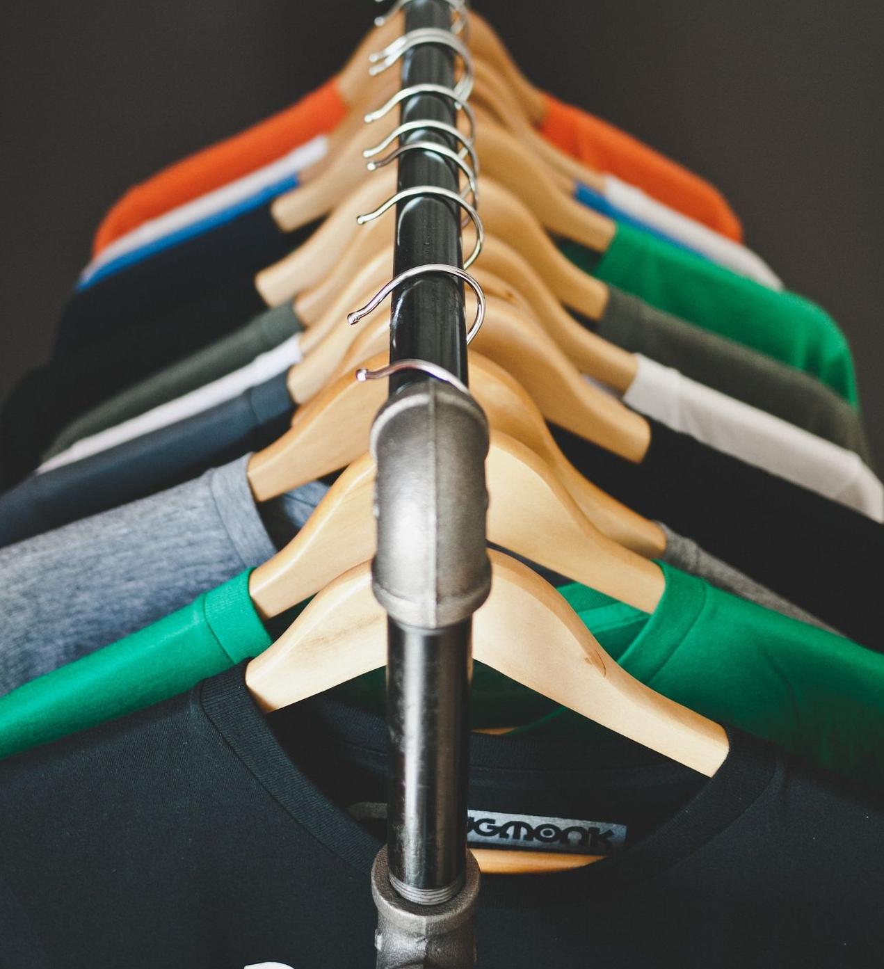 assorted-color hanged shirts with hangers